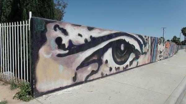 Mural wall outside of the Alpha St. entrance to Southcrest Community Park. Near Market and Shopping center & freeway (805) 43rd St.exit.