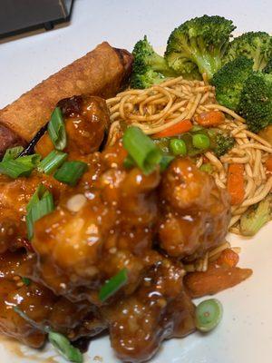 General Tso's Chicken with lo mein, steamed broccoli and eggroll.