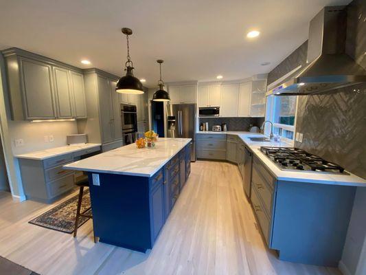 Kitchen after painted in three colors, white, gray, and blue