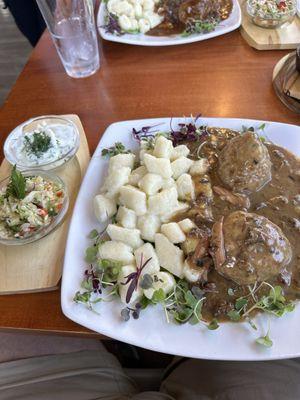 Meatballs, with a side of potatoes and salad