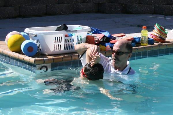 Coach Doug in the water teaching quality private swim lessons.