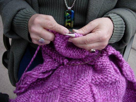 Sandra's hands. She wouldn't say it, but she is a masterful knitter and crocheter. And can teach you!