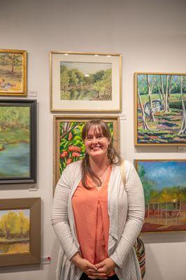 Artist Katelyn Harbaugh celebrates the plein air painting competition at the show opening, check out her art at pacesettergallery.com