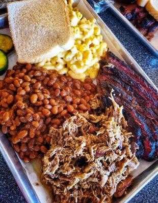 Combo plate with pulled pork & brisket with Mac & cheese and baked bean sides