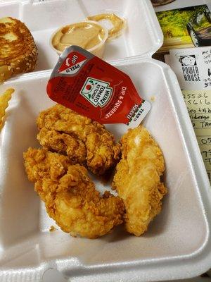 Compare the chicken tender to the size of the ketchup package