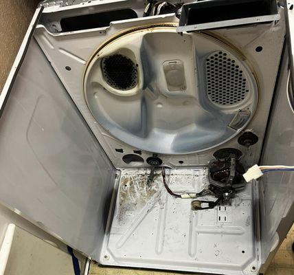 Whirlpool Dryer Internal Assembly with Drum Removed for Drum Roller Replacement