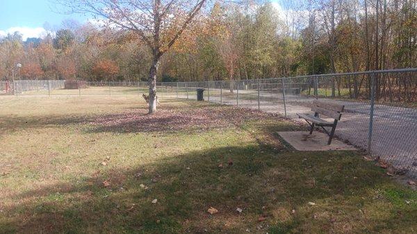 One of the multiple benches to sit on as well as a strategically placed trash can