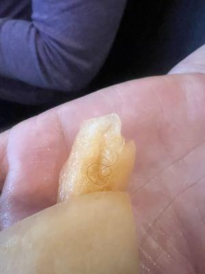 This picture shows the fruit after the waitress chewed it and spit it back into her hand.