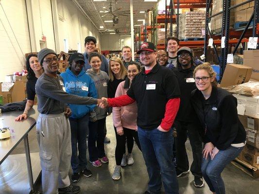 Our Team volunteering at the Second Harvest Food Bank