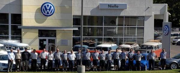 Most of our service staff. You will notice all of the vintage VW's behind them. Most are employee owned.