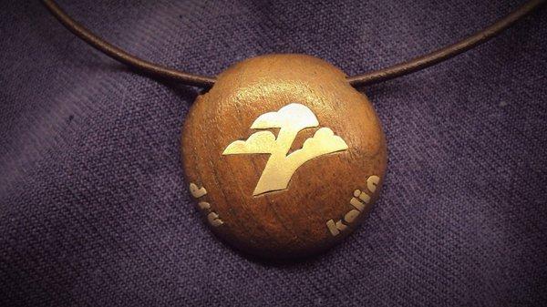 Mother's pendant. Walnut with sterling silver inlay.