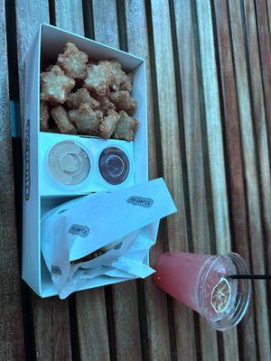 Burger and tots and absinthe drink