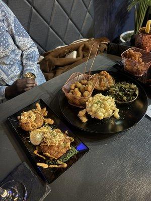 Crab cakes, fried okra, Mac n cheese, yams, greens, fried salmon