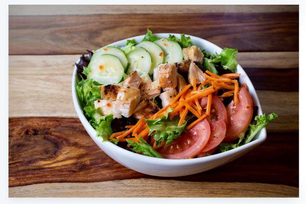 Garden salad with grilled chicken breast.