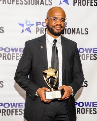 Joam Alisme accepted Schneps Media's Power Lawyer Award.