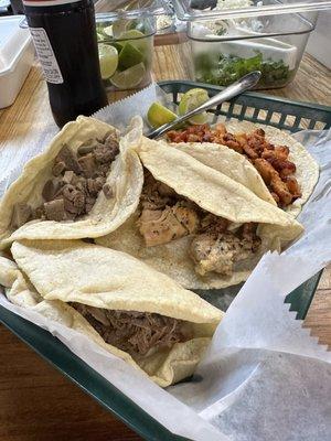 Tacos: pastor (top), pollo (middle), barbacoa (bottom), lengua (left) - you add your toppings from the bar.