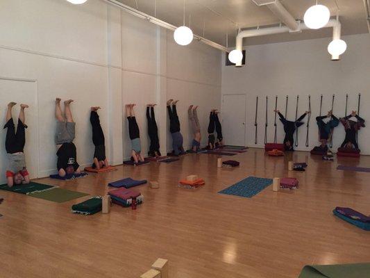 Learning headstand with props. We love Iyengar yoga.