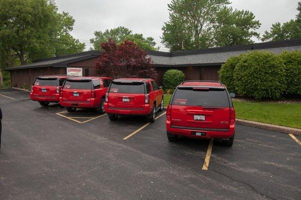 A fleet of Lohman company vehicles in our signature red.