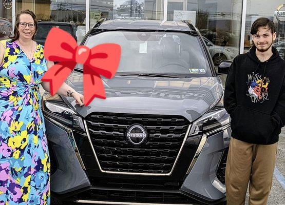 My son Gavin and I with our new car from Ken pollack Nissan.