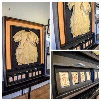 Prisoner of WWII garment with playing cards and eating utensils.