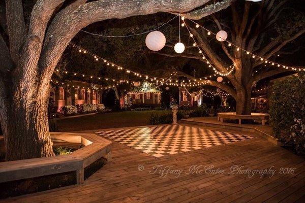 Outside deck in front of pink house. Main event space for the dance floor and ceremony.