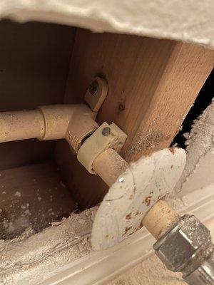 Split pipe in bathroom wall