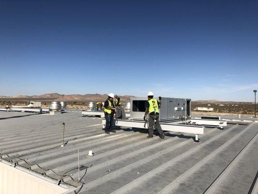 Installing some large commercial HVAC units on the roof at the Walmart Distribution Center