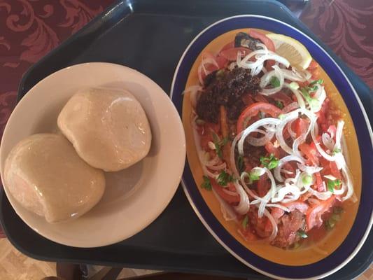 Banku and Tilapia with sliced pepper/onions/tomatoes and mild African pepper.