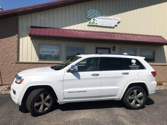 Removal vehicle with pet cot and building. No white panel van or truck used on pickups.