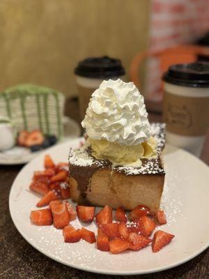 Honey bread with strawberries, Nutella, and ice cream.