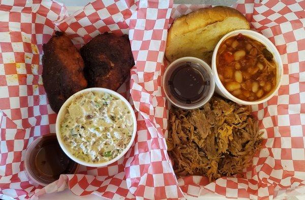 Chicken thighs with potato salad Pulled pork sandwich with baked beans