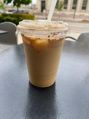 Iced oatmilk latte with honey and cinnamon