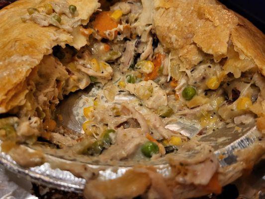 I know it looks sloppy bc I cut into it , but this chicken pot pie is Insanely delicious