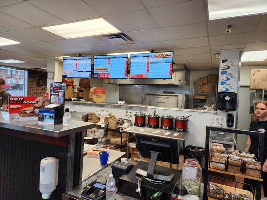 The kitchen, counter, and cash register.