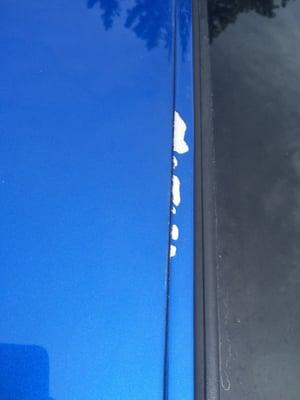 My moon roof, showing they painted over the trim, which is peeling.