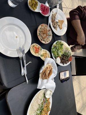 Chicken Shawarma, Beef Shawarma, Hummus, Baba Ghanoush, Lentil Rice, and Pickles.