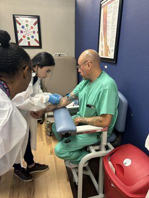 Students practicing their blood draw techniques!