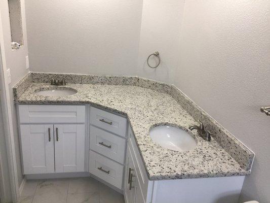 Giallo Ornamental Granite Bath Vanity top with undermount sinks.