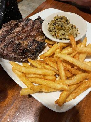 Ribeye with fries and wild rice