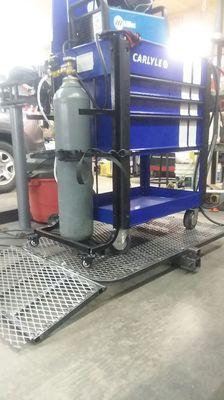 This is the Platform Carrier with a tool cart on. The cart has a custom built bottle holder for a mig welder.