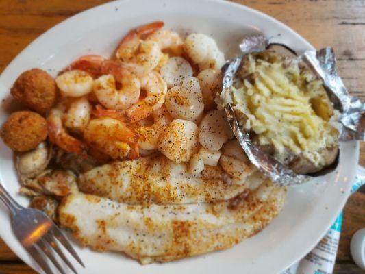 Baked potato, broiled Seafood platter.