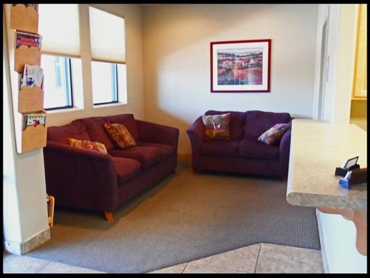 The reception area is comfortable with two soft couches and plenty of magazines and light.