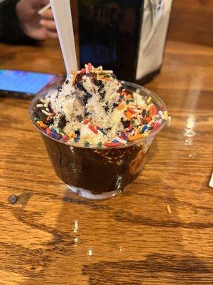 Cookies and cream with hot fudge and rainbow sprinkles