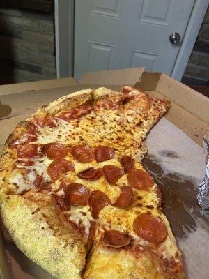 Pizza with extra cheese and half pepperoni