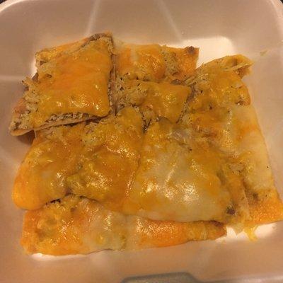 Strangest way I've ever gotten take out nachos, but these are the chips with meat and cheese, without toppings