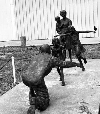 Statue between two buildings