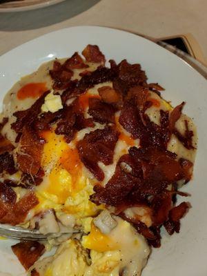 Biscuit and gravy bowl, with eggs and bacon.