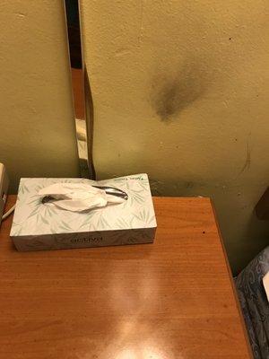 Used tissue box and smoke stained wall in our non smoking room