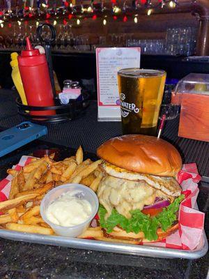 Burger with white American cheese and fried egg