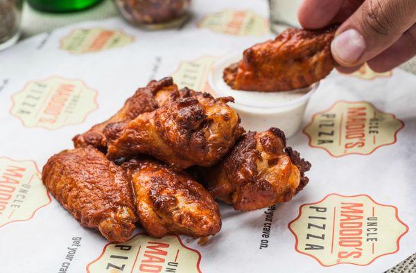 Oven Baked Wings: our wings are baked and crisped up in our oven and finished with your choice of sauce: Naked, BBQ, Buffalo or Hot!